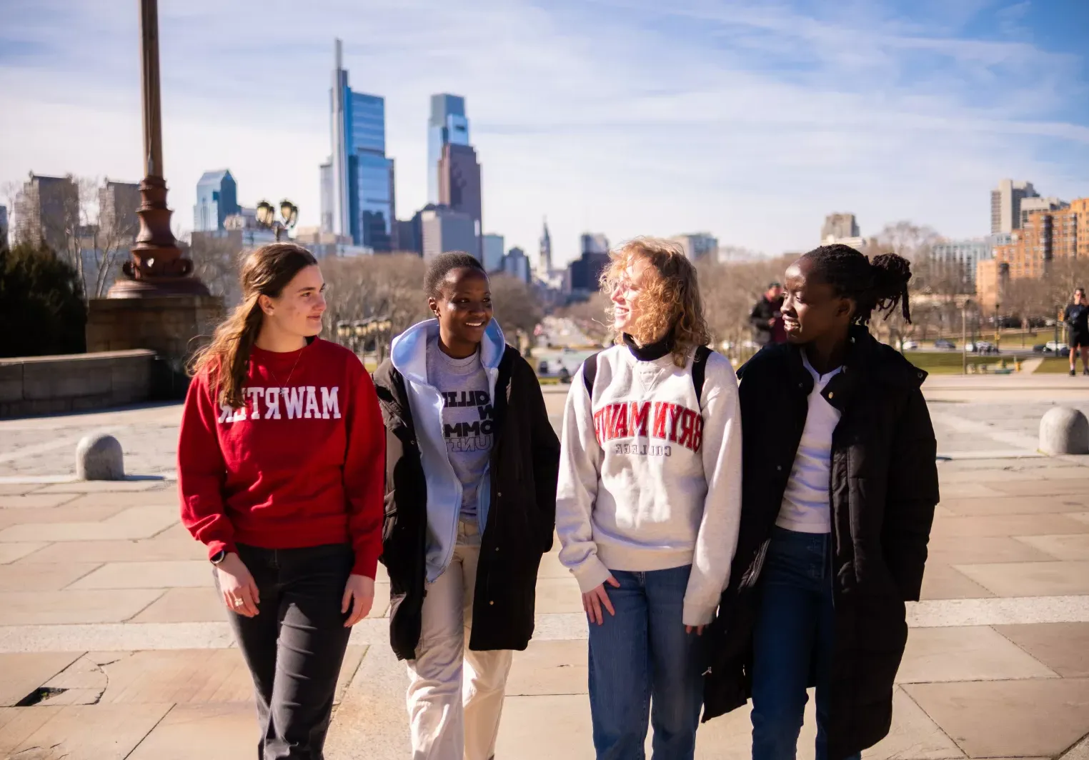 Four students walking up the "Rocky Steps" at the Philadelphia Museum of Art